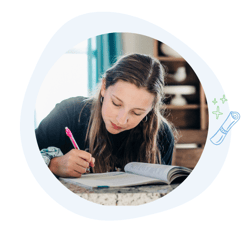 Young Girl Writing in Workbook
